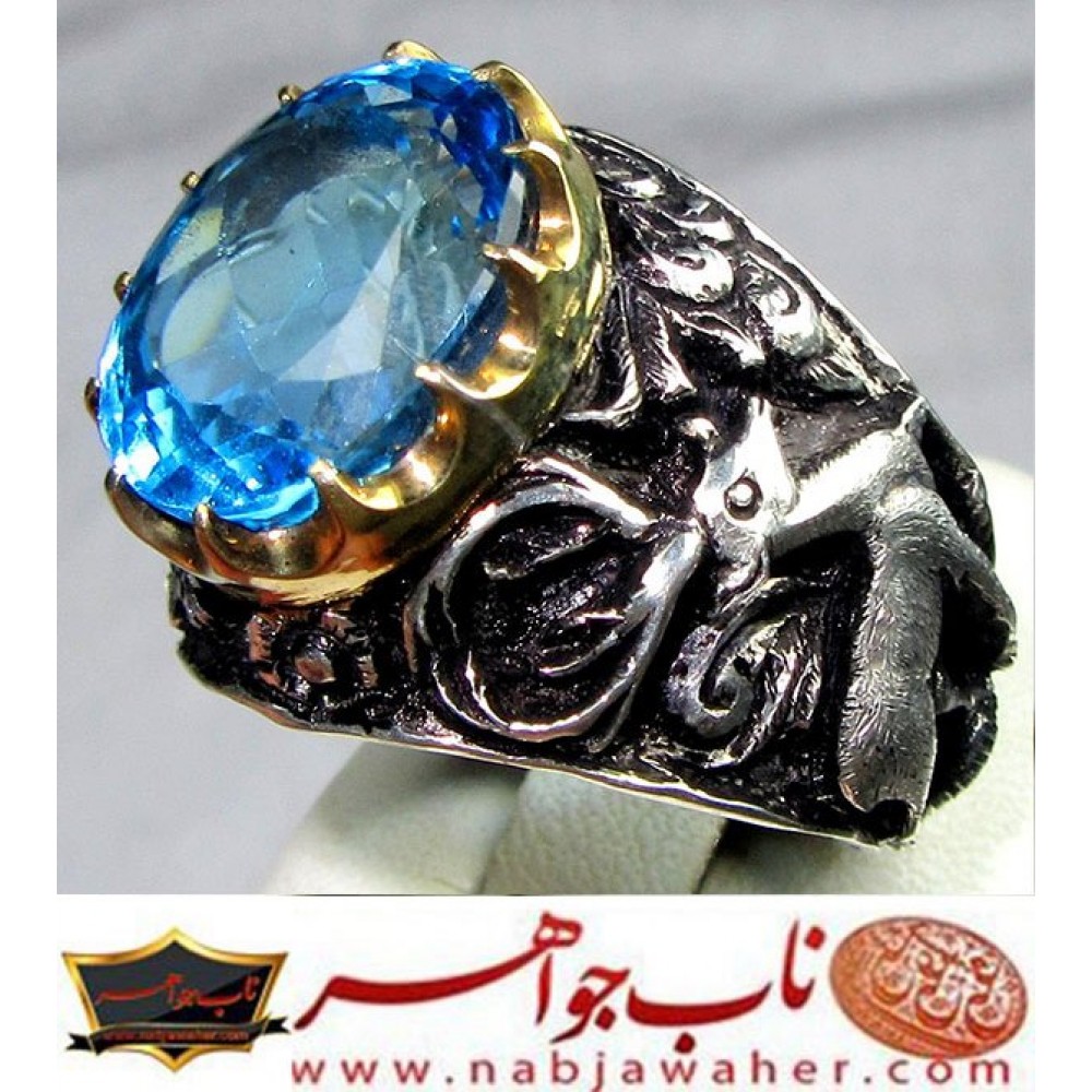 انگشترنقره مردانه توپاز اصیل همراه با شناسنامه بین المللی و رکاب فاخر احمدنامی قلمزنی جنگی